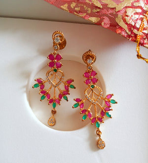 E0644_Gorgeous flower design danglers studded with american diamond stones with a touch of green and pink ruby stones.