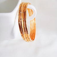 B0227_Beautiful sleek design golden bangles with a touch of stones 