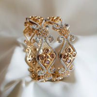 B0161_Gorgeous crafted bangles with floral design studded with American Diamond stones.