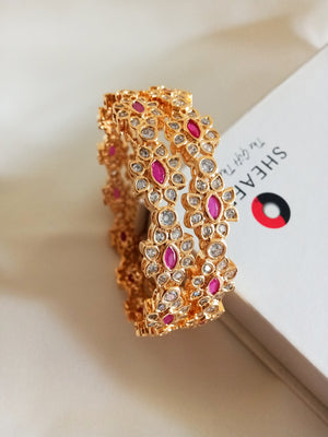 B0224_Lovely golden color bangles with delicate design and beautiful stone work.