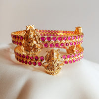 B0229_Traditional style lakshmi design golden bangles with a touch of  pink ruby stones.