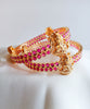 B0229_Traditional style lakshmi design golden bangles with a touch of  pink ruby stones.