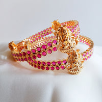 B0229_Traditional style lakshmi design golden bangles with a touch of  pink ruby stones.