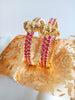 B0229_Traditional style lakshmi design golden bangles with a touch of  pink ruby stones.