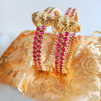 B0229_Traditional style lakshmi design golden bangles with a touch of  pink ruby stones.
