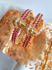 B0229_Traditional style lakshmi design golden bangles with a touch of  pink ruby stones.