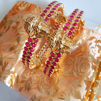 B0229_Traditional style lakshmi design golden bangles with a touch of  pink ruby stones.