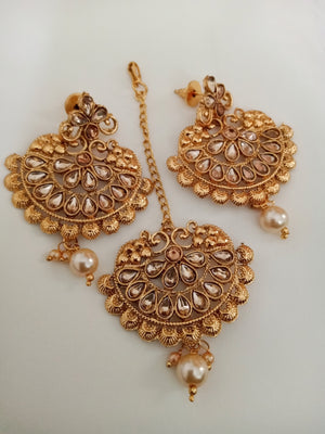 M018_Beautiful design golden color earring & maang tika combo with delicate work with a touch of pearl drop.