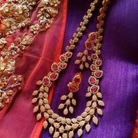 N0349_Elegant Temple jewelry style matte gold polish necklace set studded with American Diamond  stones with a touch of pink ruby stones.