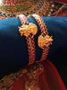 B0229_Traditional style lakshmi design golden bangles with a touch of  pink ruby stones.