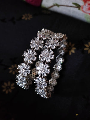 B0210_S_Lovely flower design Silver plated Bangles studded with American Diamond stones.