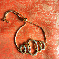 B0233_Trendy rose gold oval design bracelets studded with american diamond stones.