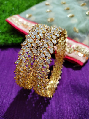 B014_Classy Style Gold Plated Bangles studded  with American Diamond stones.