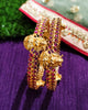 B0229_Traditional style lakshmi design golden bangles with a touch of  pink ruby stones.