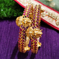 B0229_Traditional style lakshmi design golden bangles with a touch of  pink ruby stones.