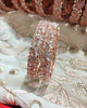 B0240_Lovely Rose gold bangle with delicate design embellished with American Diamond stones.