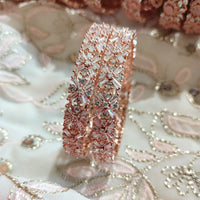 B0240_Lovely Rose gold bangle with delicate design embellished with American Diamond stones.
