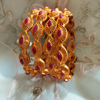 B0240_Traditional style Gold plated bangles studded with pink ruby stones.