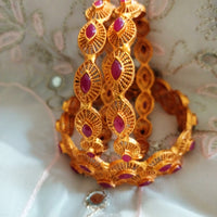 B0240_Traditional style Gold plated bangles studded with pink ruby stones.