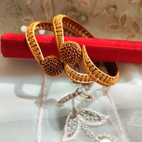B069_Gorgeous Gold plated bangles studded with pink ruby stones.