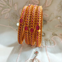 B0242_Classic style gorgeous Gold plated bangles studded with pink ruby stones.