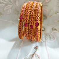 B0242_Classic style gorgeous Gold plated bangles studded with pink ruby stones.