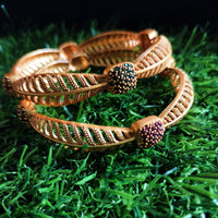 B0250_Lovely Trendy style Gold plated bangles with delicate craft work with a touch of ruby stones.