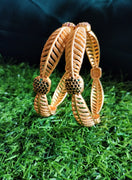 B0250_Lovely Trendy style Gold plated bangles with delicate craft work with a touch of ruby stones.