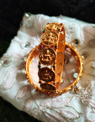 B0252_Lovely Ethnic style lakshmi design bangles with delicate work with a touch of green & pink ruby stones.