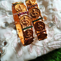 B0254_Lovely Ethnic style lakshmi design bangles with delicate work with a touch of green & pink ruby stones.