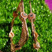 B0255__Elegant trendy designer bangles with delicate designs and unique patterns studded with american diamond stones.