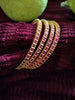 B0257_Gorgeous golden bangles embellished with a touch of pink ruby stones.