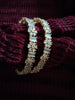 B0259__Elegant designer bangles with delicate designs studded with american diamond stones with a touch of ash color stones.