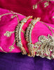 B0267_Lovely designer Gold plated bangles studded with  American Diamond  stones with delicate stone work.