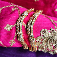 B0267_Lovely designer Gold plated bangles studded with  American Diamond  stones with delicate stone work.