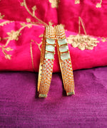 B0271_Classic Gold plated bangles studded with  delicate American Diamond  stones with a touch of green stones.