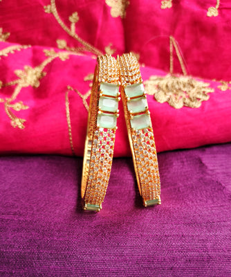 B0271_Classic Gold plated bangles studded with  delicate American Diamond  stones with a touch of green stones.