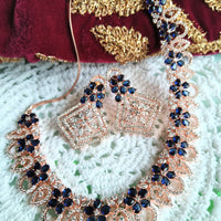 N0409_Gorgeous necklace embellished with american diamond stones with a touch of blue stones with delicate work.