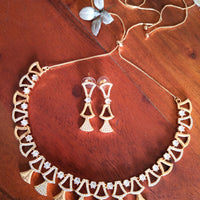 N0410_Classy golden necklace embellished with american diamond stones with delicate patterns.