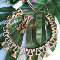 N0410_Classy golden necklace embellished with american diamond stones with delicate patterns.