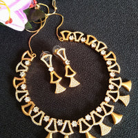 N0410_Classy golden necklace embellished with american diamond stones with delicate patterns.