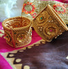 B0280_Lovely broad style Ethnic screw design bangles with delicate work of flower design  with a touch of ruby and american diamond stones.