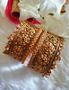 B0281_Grand broad style Ethnic screw design bangles with delicate work with a touch of ruby and american diamond stones along with bead drops.