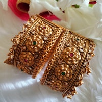 B0281_Grand broad style Ethnic screw design bangles with delicate work with a touch of ruby and american diamond stones along with bead drops.