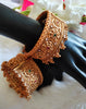 B0281_Grand broad style Ethnic screw design bangles with delicate work with a touch of ruby and american diamond stones along with bead drops.