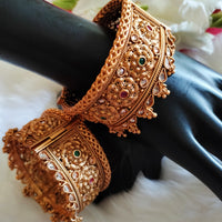 B0281_Grand broad style Ethnic screw design bangles with delicate work with a touch of ruby and american diamond stones along with bead drops.
