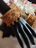 B0281_Grand broad style Ethnic screw design bangles with delicate work with a touch of ruby and american diamond stones along with bead drops.