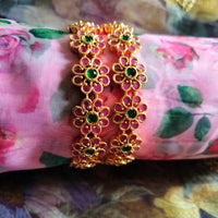 B0288_Beautiful flower design golden bangles with delicate craftwork with a touch of ruby stones.