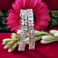 B0291_Lovely floral design Bangles studded with American Diamond stones with a touch of mint green stones.