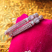 B0296_Elegant designer rose gold  bangles studded with American Diamond stones with delicate stone work.
